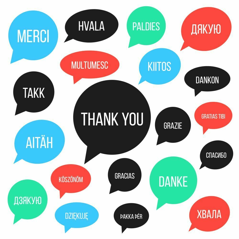 White thank you lettering in different languages in colored spee